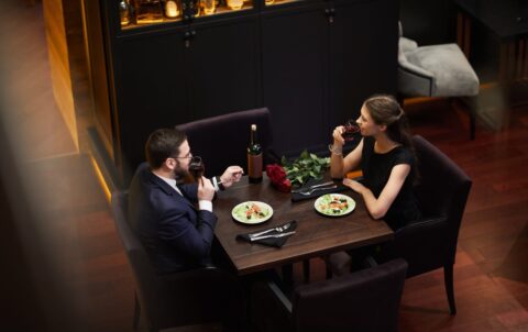 Couple enjoying a romantic dinner NYC experience at Andrew Steak Society