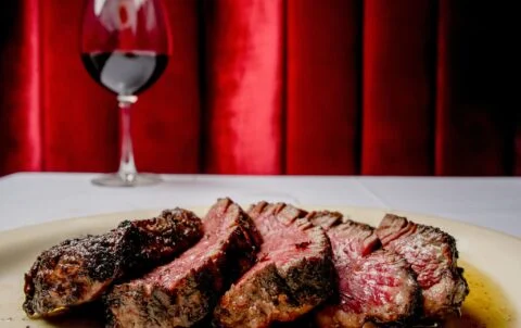 Wood-fired grill and dry-aged Tomahawk at Andrew Steak Society, one of the top steakhouses in Manhattan